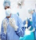 Doctor with mask and gloves in the operating room